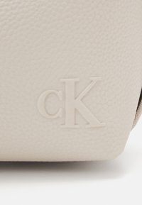 Calvin Klein Jeans ULTRALIGHT SHOULDERBAG - Handbag - eggshell