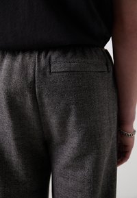 Puma RELAXED TRACK PANTS - Trainingsbroek - black/alpine snow