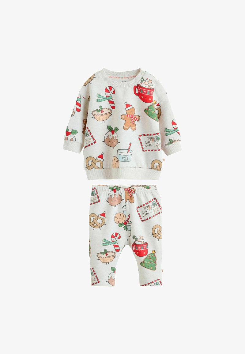 Børns top med lange ærmer og bukser med juletema, herunder honningkager, sukkertøjstænger, juletræer, kringler og julegodter.