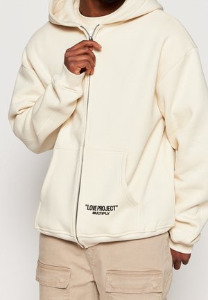 Tröja med dragkedja - beige