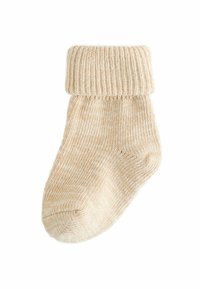 Beige gestrickte Socke mit geripptem Bund und strukturiertem Muster, aus weichem, dehnbarem Stoff und mit runder Zehenform.