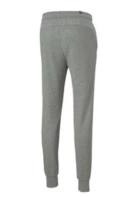 Pantalones de chándal grises hechos de una tela suave, con un puño ajustado en el tobillo, una cintura elástica y un detalle de costura minimalista.