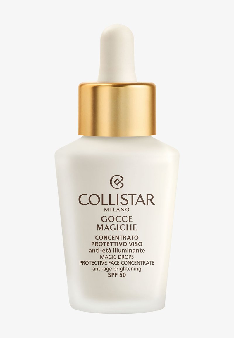 Butelka z pipetą Collistar Milano Gocce Magiche przeciwstarzeniowy rozświetlający koncentrat do twarzy z SPF 50 i złotą zakrętką na białym tle.