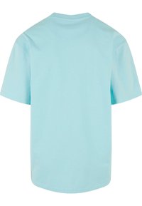 Light blue cotton t-shirt with a crew neck and short sleeves. Smooth texture, relaxed fit, and a clean, simple design without embellishments.