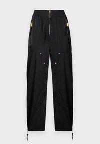 Μαύροι cargo παντελόνια ψηλόμεσα με χρυσό φερμουάρ και λεπτομέρειες με κουμπιά, ελαστική μέση, πλαϊνές τσέπες και ρυθμιζόμενα κορδόνια στους αστραγάλους.