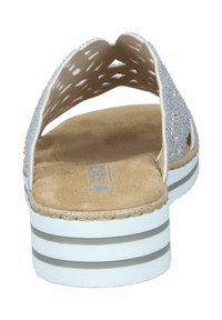 Wedge sandal with a textured blush upper, adorned with silver rhinestones, a cushioned tan footbed, and a white striped platform sole.