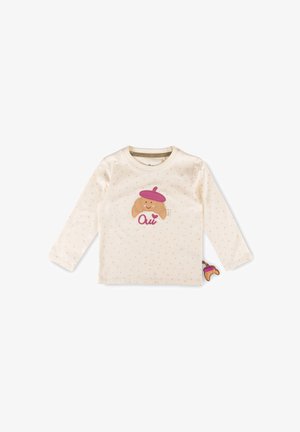Maglietta crema a maniche lunghe per bambino con piccoli puntini rosa, applicazione di un croissant sorridente con basco viola e testo rosa "Oui" sulla parte anteriore.