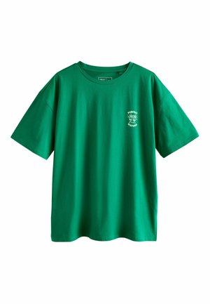 Green short-sleeve t-shirt with round neck and small white graphic on left chest reading "Perfect Matcha" with two matcha bowls.
