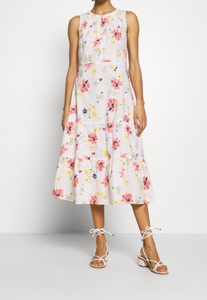 Floral midi dress featuring pink, yellow, and blue flowers on a white background, with a tiered skirt, sleeveless design, and subtle pleats.