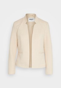 Blazer beige con un patrón de espiga texturizado. Presenta un diseño sin cuello y dos bolsillos frontales. Interior completamente forrado.
