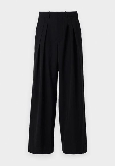 Black trousers featuring a wide leg design, pleats at the front, and a structured waistband. Made from a smooth fabric with no visible accents.