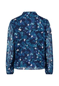 Navyblauwe blouse van een doorschijnende stof, met een bubbeltjespatroon in verschillende tinten blauw en wit. Lange, gathered mouwen en een kraag.