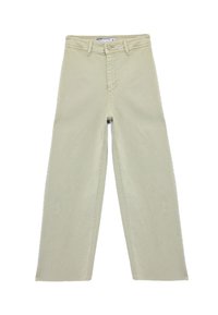 Beige korkeavyötäröiset farkut, joissa on leveät lahkeet, nappi- ja vetoketjusulku, vyölenkit sekä näkyvät saumat edessä ja sivuilla.