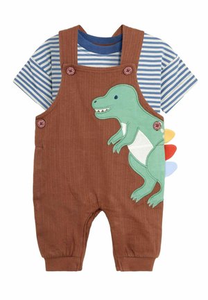 Ruske sametne kombinezone s aplikacijom zelene dinosaura, crvenim, žutim i plavim bodljama, uparen s plavom i bijelom prugastom majicom.