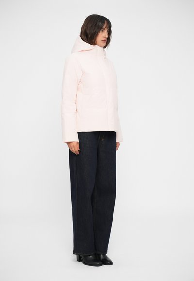Light pink puffer jacket with a hood, featuring a smooth texture and side pockets, paired with dark wide-leg jeans and black boots.