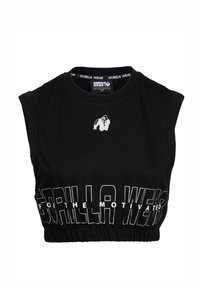 Zwarte mouwloze crop top gemaakt van katoen, met een ronde hals en elastische zoom. Voorzien van witte tekst en een klein gorilla-logo.