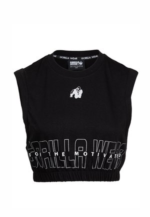 Zwarte mouwloze crop top gemaakt van katoen, met een ronde hals en elastische zoom. Voorzien van witte tekst en een klein gorilla-logo.