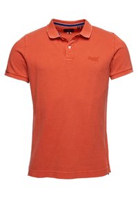 Polo en coton de couleur orange, doté d'un col standard, de manches courtes et d'un logo discret sur la poitrine. Coupe classique avec des détails de couture.