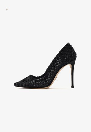 Black high-heeled pump with a pointed toe, featuring a textured upper adorned with black sequins and a slender stiletto heel.