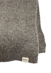 Gray knitted scarf made from soft, textured wool. Featuring a small label with "BARTS" and "AMSTERDAM" in a contrasting color.