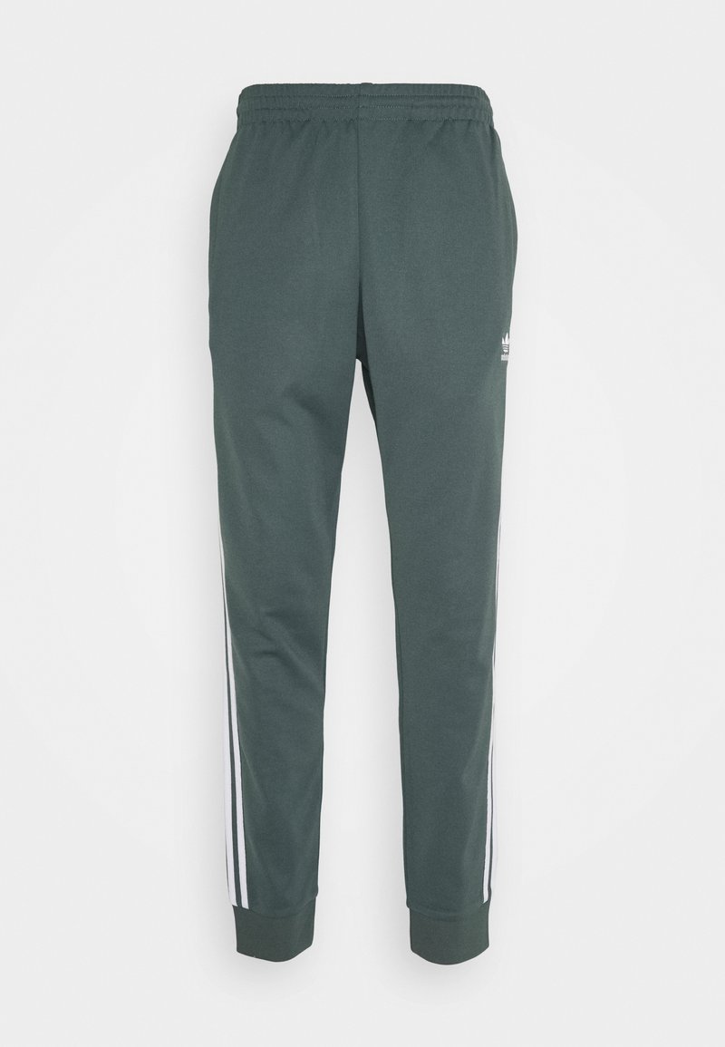 Pantaloni sportivi verdi realizzati in materiale morbido, con strisce laterali bianche e una cintura elastica. Caviglie con polsini aderenti.