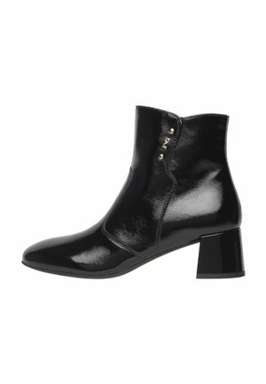 Black patent leather ankle boots with a pointed toe, small block heel, side accents, and smooth texture. Clean, sleek silhouette.