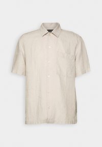 Linnen overhemd met korte mouwen in lichtbeige, met een kraag, knopen aan de voorkant en een borstzak. Zachte, gestructureerde stof.