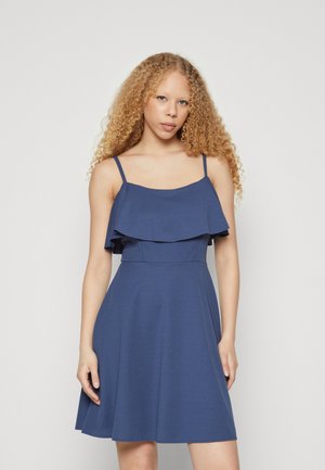Blue sleeveless dress featuring a ruffled top layer, flared skirt, and smooth texture, suitable for casual occasions.