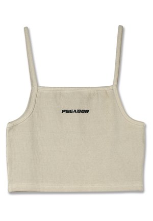Top corto beige a costine con spalline sottili e logo "PEGADOR" in nero sul davanti. Texture liscia, design minimalista.