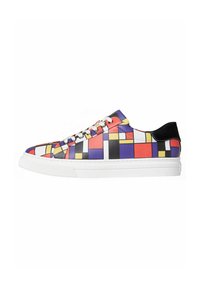 Multicolored sneaker featuring a geometric pattern in red, yellow, blue, and black, with a white rubber sole and black suede heel accent.