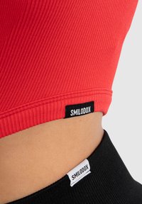Smilodox SERINA - Træningsjakke - rot