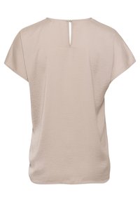 Blouse beige à manches courtes avec une coupe ample, présentant une petite fente dans le dos et une fermeture par bouton au niveau du col.