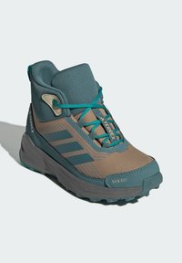Brown and teal hiking boot made of synthetic materials. Features a textured upper, padded collar, laces, and a rugged rubber sole.