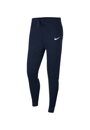 Pantalon de sport bleu marine à coupe fuselée, avec une taille à cordon de serrage, des poches latérales, des bas resserrés aux chevilles et un swoosh Nike blanc, présenté sur un fond blanc.