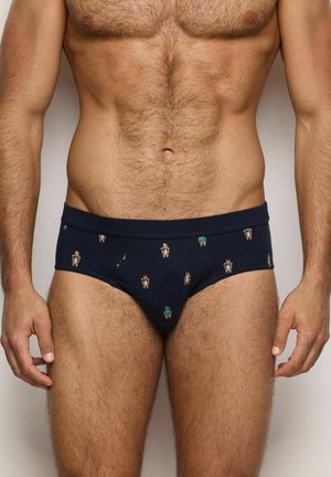 Slip da uomo blu navy realizzati in tessuto morbido, caratterizzati da un motivo ripetuto di orsetti di cartone di vari colori. Include una cintura elastica.