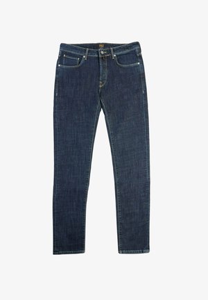 Jean en denim bleu foncé avec une coupe slim, comportant cinq poches, une braguette zippée et des accents de surpiqûres dorées sur les coutures.