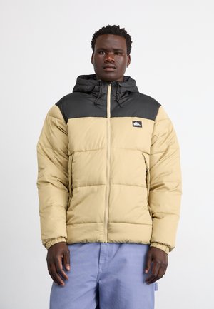 Puffersjakke med en beige krop og en sort overdel, med hætte, lynlås lukning og elastiske manchetter. Bemærkelsesværdigt logo på brystet.