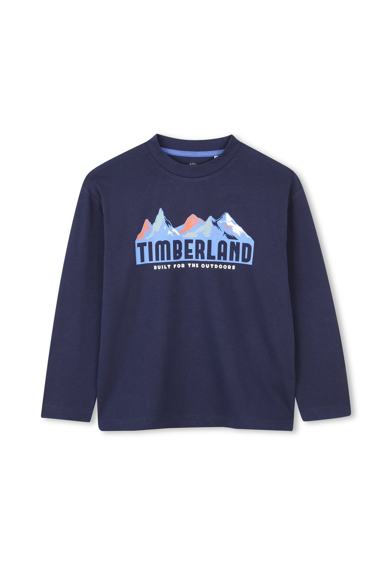 Sötétkék, hosszú ujjú pamut póló, amelyen hegygrafika és "TIMBERLAND" felirat található az elején. Kerek nyakú kivitel.