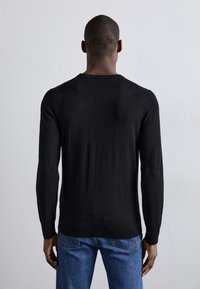 Filippa K Strickpullover - black