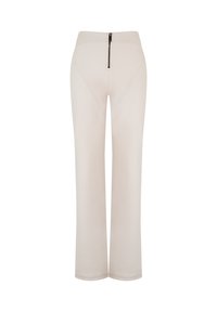 Pantalon crème ajusté avec une taille haute, doté d'une fermeture éclair à l'arrière et d'un tissu lisse et texturé. Design classique à jambe droite.