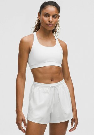 ENERGY EVOLVE - Sportmelltartó közepesen nehéz sportoláshoz - white