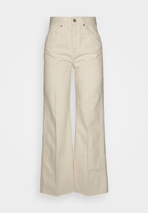 Beige wide-leg jeans made of cotton, featuring a high waist, front pockets, and frayed hems for a textured finish.