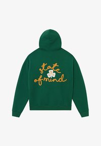 Zelená mikina s kapucňou s vyšitou oranžovou nápisom "state of mind" a bielym kvietkom na zadnej strane. Mäkká látka, voľný strih.
