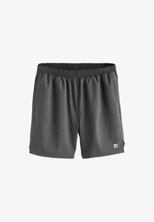 Tmavosivé pánske športové šortky s elastickým pásom, bočnými vreckami a malým trojuholníkovým logom na ľavom leme nohavice.