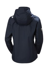 Marineblauwe waterdichte jas met capuchon, voorzien van een subtiel logo op de mouw en een gladde textuur, ontworpen voor gebruik buitenshuis.