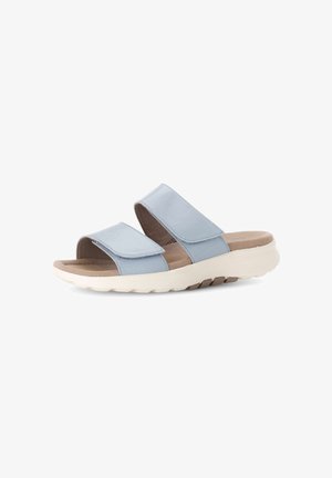 Blue leather slide sandals with two adjustable straps, a soft interior, and a thick white rubber sole with a textured bottom for grip.
