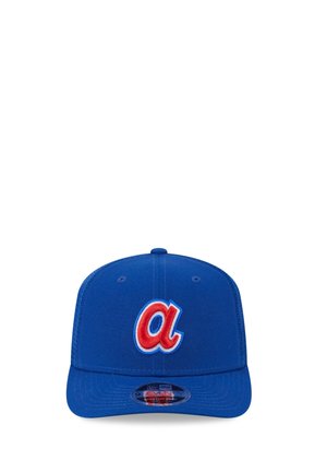 Blue baseball cap with a red lowercase "a" outlined in white and light blue on the front panel, flat brim, and adjustable snapback.