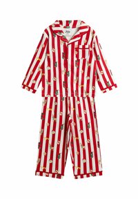 Punavalkoraidallinen lasten pyjamasetti, jossa on jouluteemaisia kuvioita kuten poroja, sukkia ja piparkakkuja pehmeällä kankaalla.