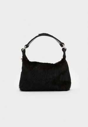 Black faux fur handbag with a soft texture, rounded shape, and a sturdy black leather shoulder strap. Silver hardware accents visible.