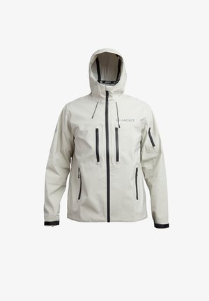 Hellbeige wasserdichte Jacke mit Kapuze, schwarzen Reißverschlüssen, verstellbaren Bündchen und mehreren Fronttaschen. Glatte Textur, funktionales Design.